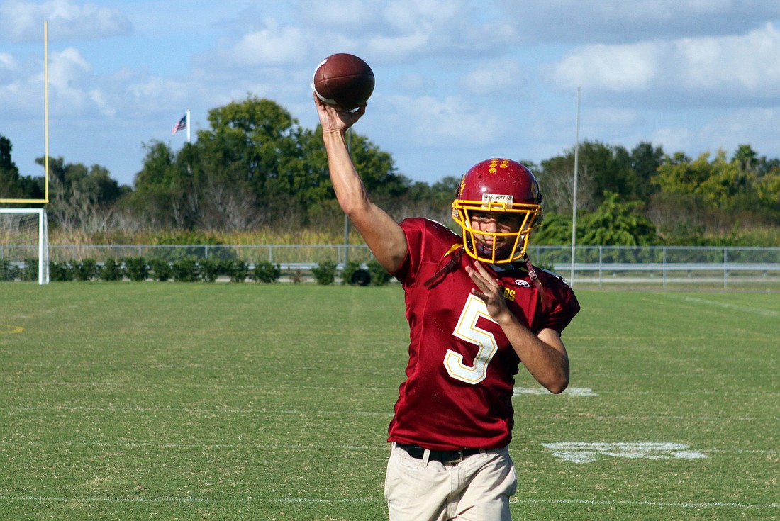 Alex Nugent, senior at Cardinal Mooney, throwing the football around with a friend.