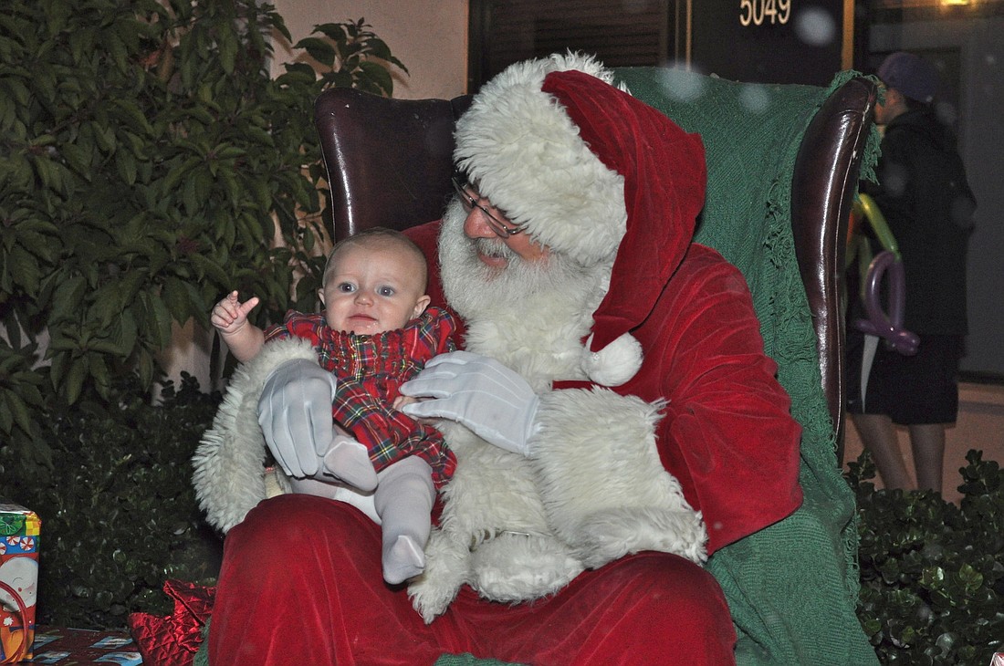 Jordyn Hanwright tells Santa Claus what she wants for Christmas.