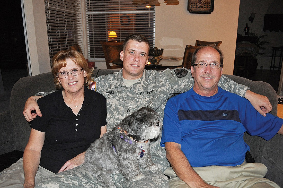 Tara residents Carol and Tom Younger said they were thrilled to have their son, Greg, center, home for Thanksgiving. "We were tickled pink when we found out," Carol said.