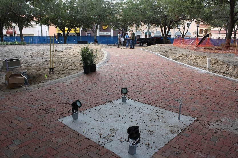 The Downtown Improvement District's park-improvement project includes a paver walkway and small performance stage.
