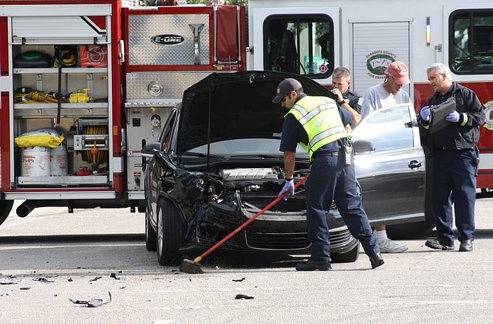 This black Volkswagen had its front end smashed and had to be towed.