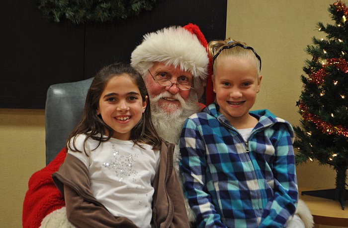 Skylar Metnick and Alex Lane tell Santa what they want for Christmas.