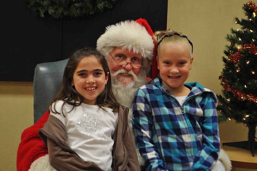 Skylar Metnick and Alex Lane tell Santa what they want for Christmas.