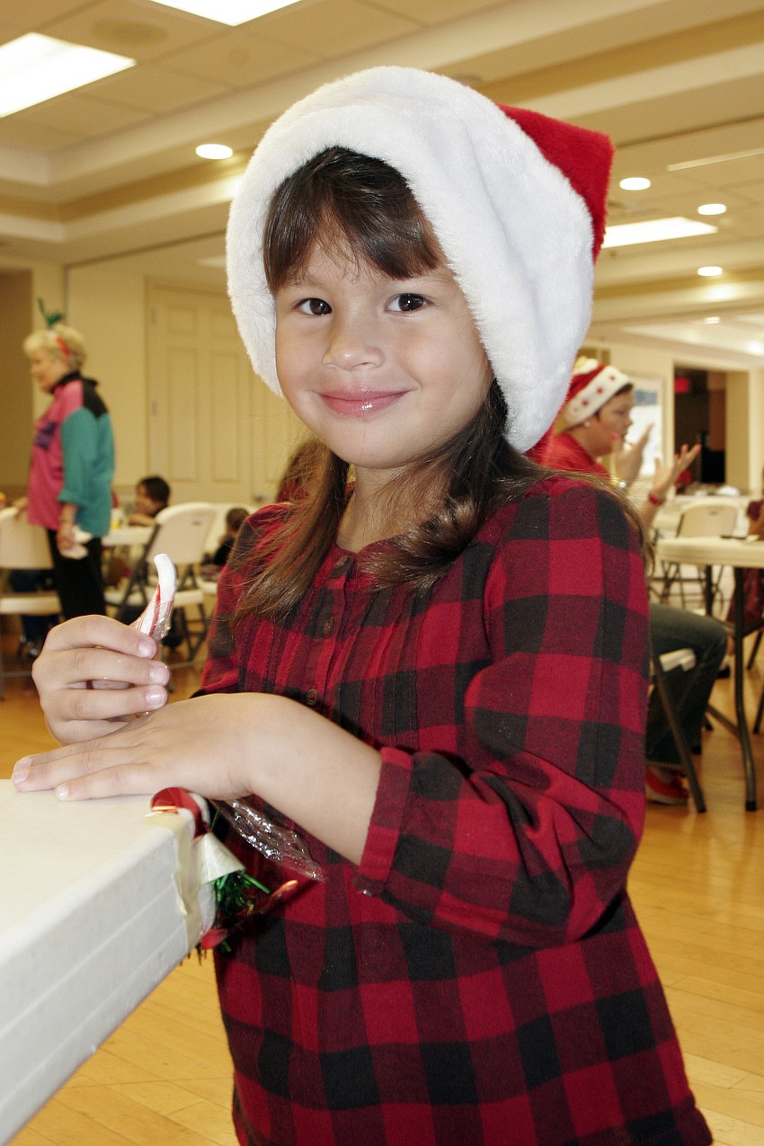 Four-year-old Eva Arend couldn't wait to dig into her candy cane.