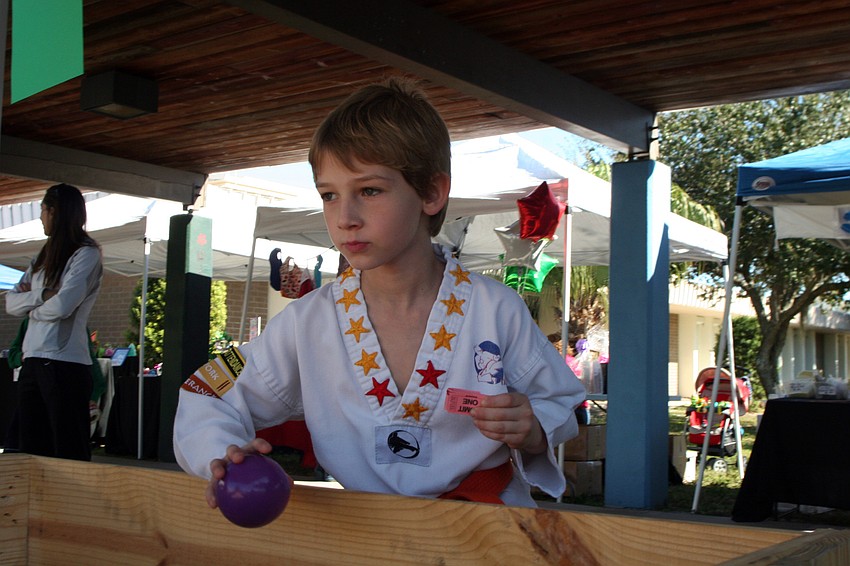 Six-year-old Peter Sziaglyi had a blast playing the carnival-style games.