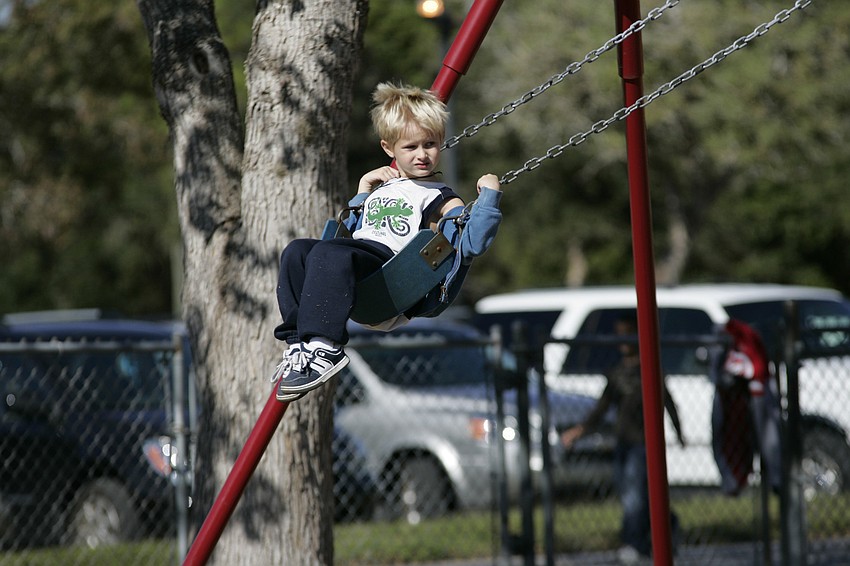 Four-year-old Caleb Rouse couldn't wait to play on the swing set.