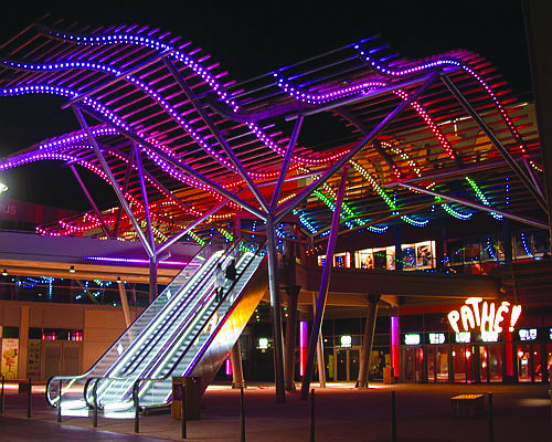 The colorful and elaborate lighting display at this shopping center in Vaulx-en-Velin, France, shows the capabilities of the lighting system that will be installed at Selby Five Points Park.