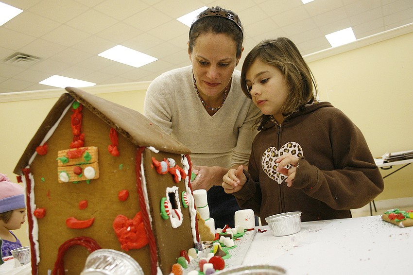 Lara Cosgrove had a blast creating a gingerbread house with her daughters, Elise (pictured) and Cecelia.