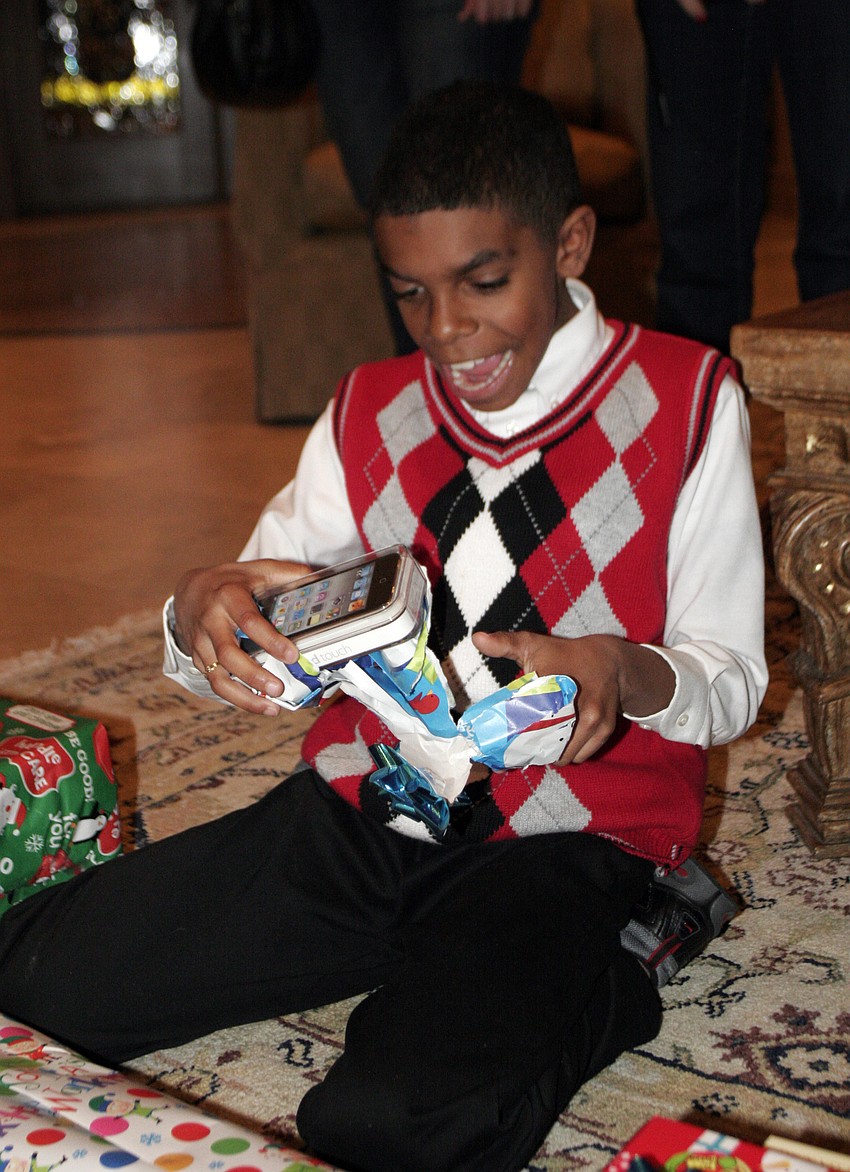 Rickey Tedescl, 11, couldn't contain his excitement as he opened his new iPod Touch.