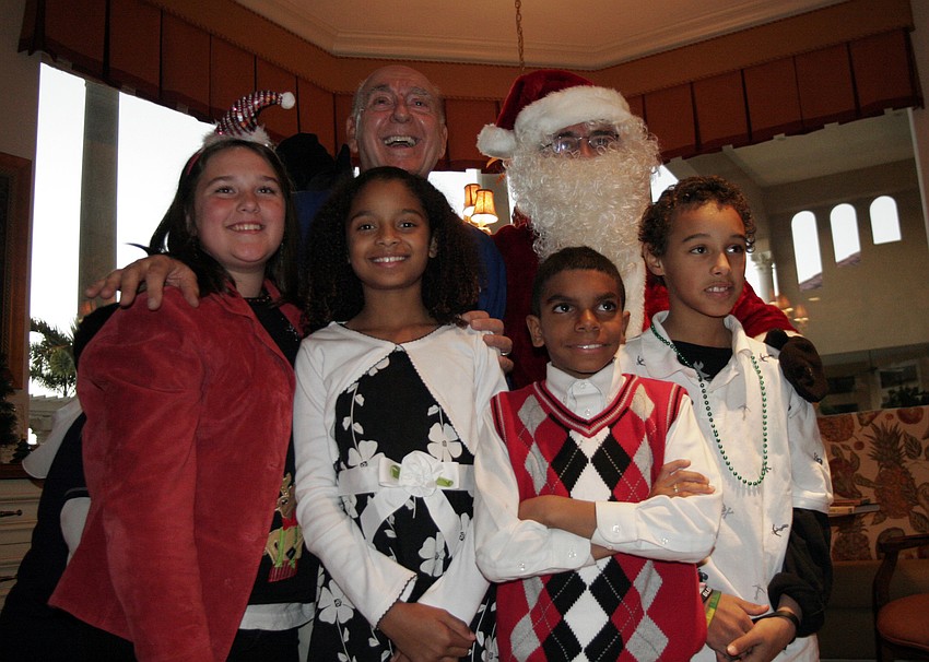 Santa Claus delighted the children with a surprise visit.