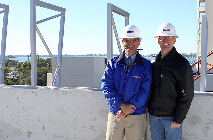 Team leaders Mike Beaumier, vice president of Suffolk Construction, and Jonathan Parks, senior principal of Jonathan Parks Architect, on sixth level of the Palm Avenue parking garage.