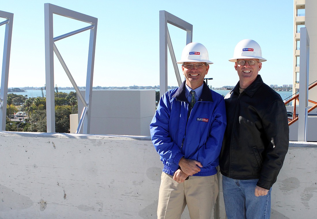 Team leaders Mike Beaumier, vice president of Suffolk Construction, and Jonathan Parks, senior principal of Jonathan Parks Architect, on sixth level of the Palm Avenue parking garage.