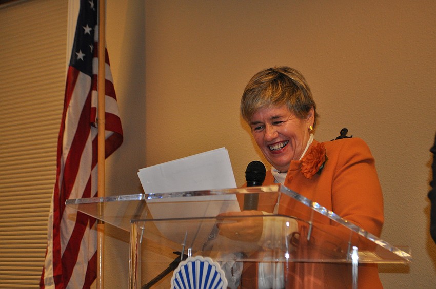 Wendy Hopkins announces the names of the grant recipients.