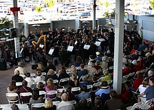 The Sarasota Orchestra performed to a large crowd in the courtyard of Mote Aquarium on Tuesday, Dec. 21.