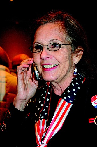 District 1 Commissioner-Elect Lynn Larson gets the news that she beat Mayor Lee Rothenberg.
