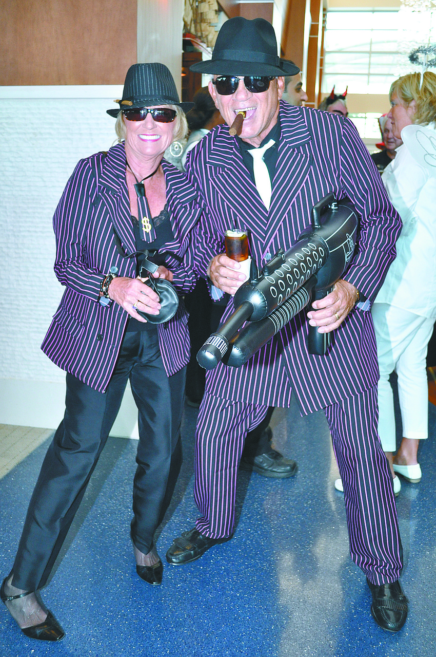 Margit and Dick Gravino made a hilarious pair as mobsters at Sarasota Yacht Club's Halloween party.