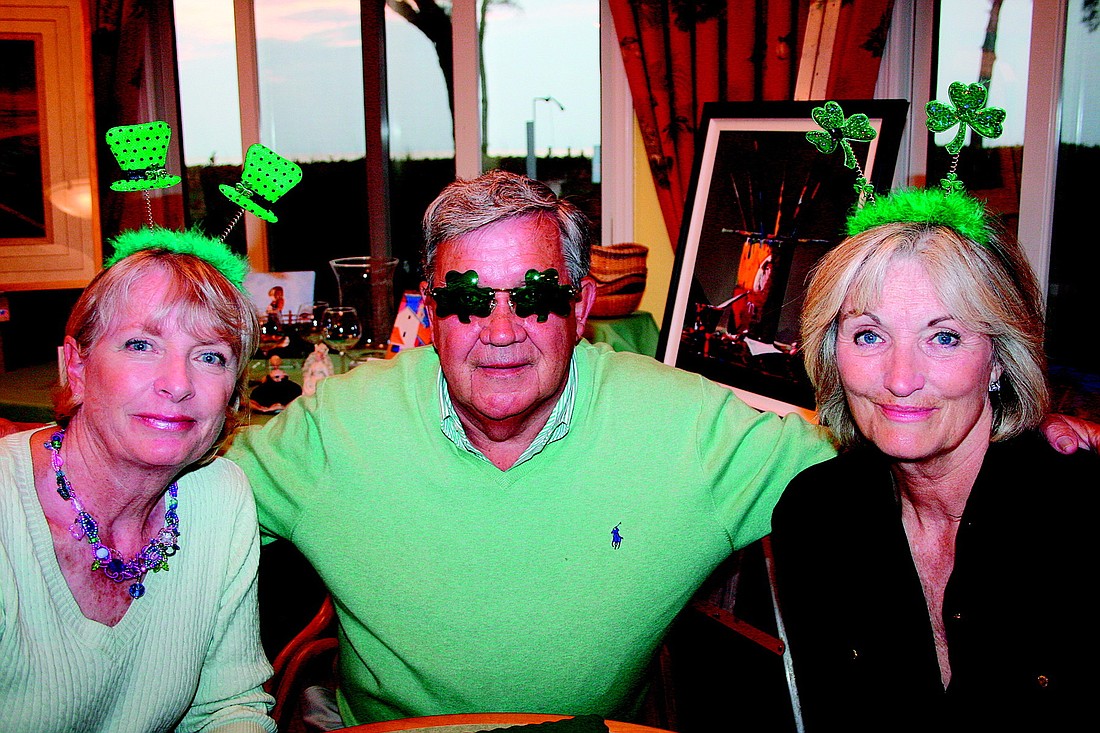 Joanne and Kent Knowlton and Anne Young celebrate St. Patrick's Day in March at Club Longboat.