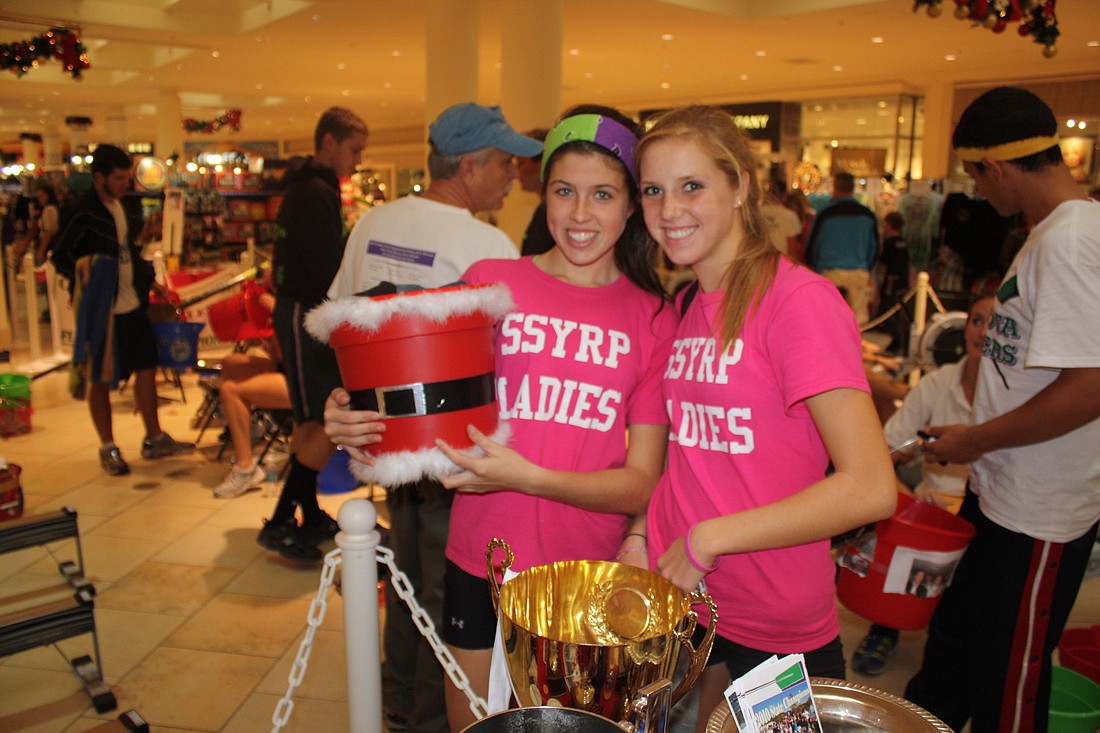 Cassidy Marryott and Payton Harris show off their Santa bucket.