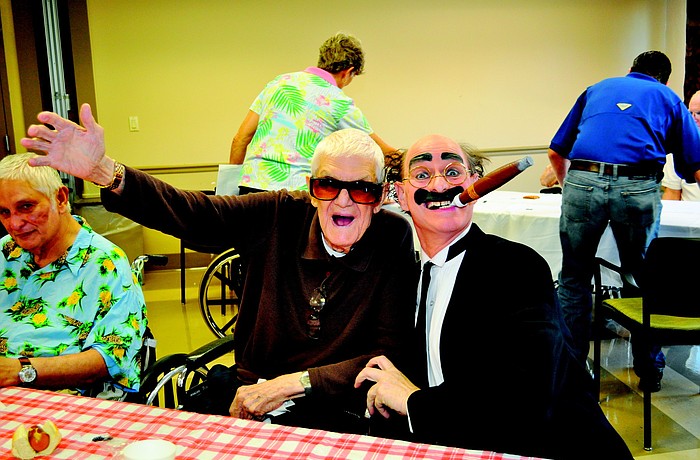 Herb Lee and Chuck Sidlow joked around in June at The Pines of Sarasota feast and casino party.