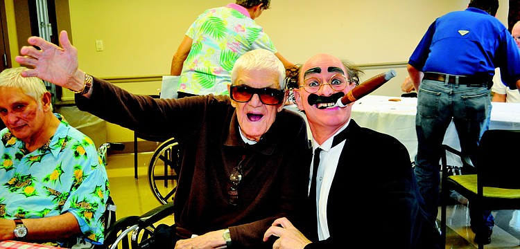 Herb Lee and Chuck Sidlow joked around in June at The Pines of Sarasota feast and casino party.