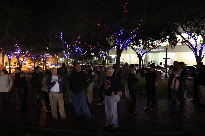 The crowd takes in the first view of the Five Points Selby Park LED tree lighting system.