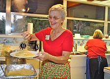 Co-Chairwoman Gloria Lowe serves up a piping hot plate of pasta.