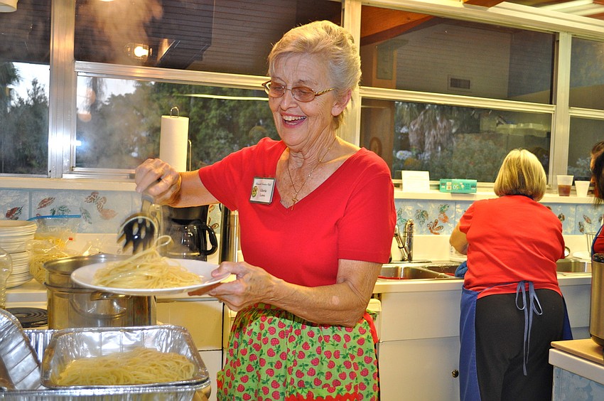Co-Chairwoman Gloria Lowe serves up a piping hot plate of pasta.