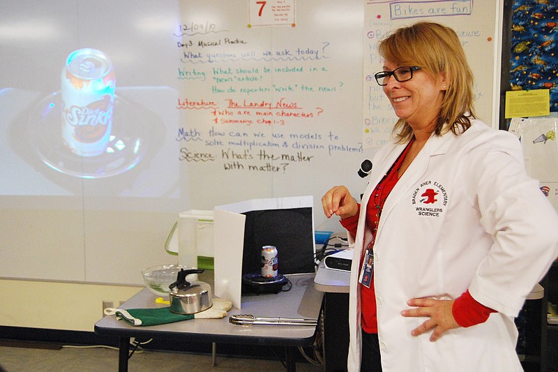 Teacher Sue Curry dressed as Bill Nye, The Science Guy, for the interactive lesson.