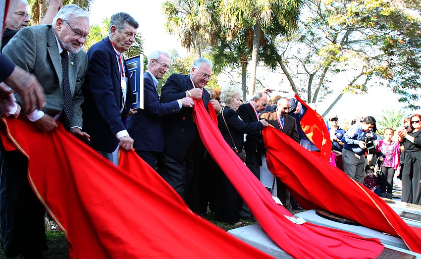 The sponsors and newly inducted members of the Circus Ring of Fame unveil their plaques on Sunday afternoon on St. Armands Circle.