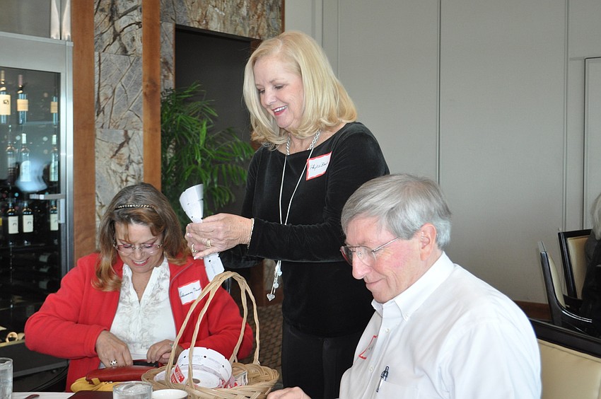 Shannon Gault, President Phyllis Black and John Wild