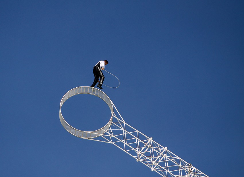 Joseph Bauer prepares to jump rope while riding the â€œWheel of Destinyâ€ on Tuesday morning.