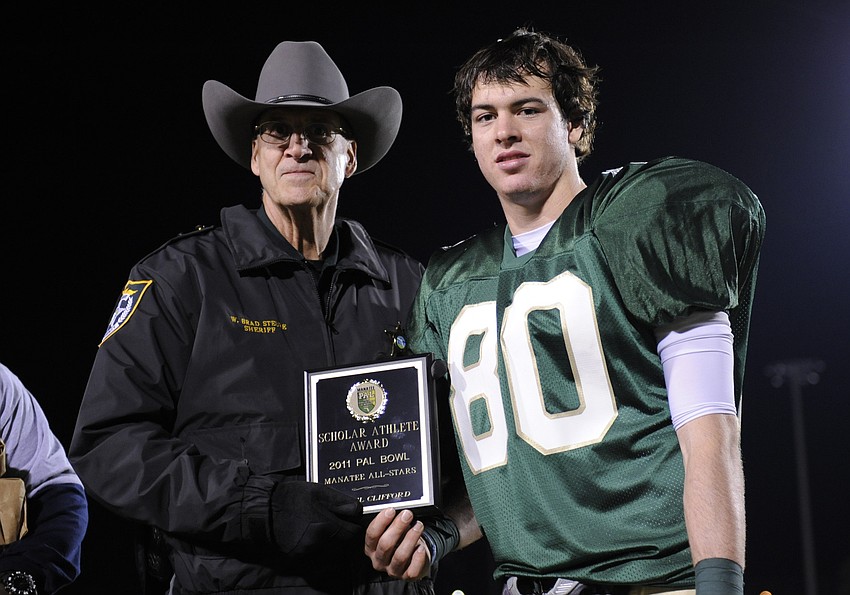 Manatee County Sheriff Brad Steube presented Daniel Clifford, who maintains a 4.48 grade-point average, with the scholar-athlete award.