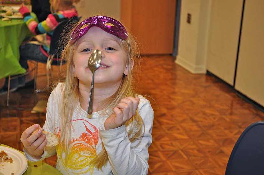 Riley Putnam practices her spoon-sticking talents.