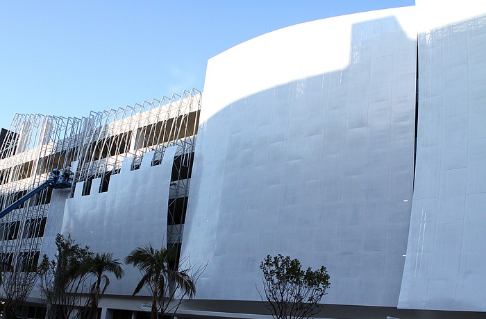 Construction workers began putting on the sails onto the front side of the recently opened Palm Avenue parking garage Thursday, Jan. 20.