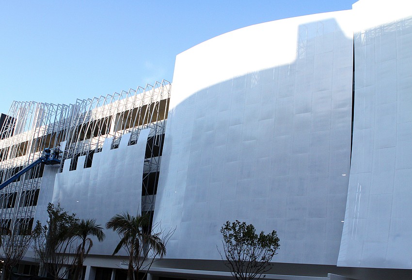 Construction workers began putting on the sails onto the front side of the recently opened Palm Avenue parking garage Thursday, Jan. 20.