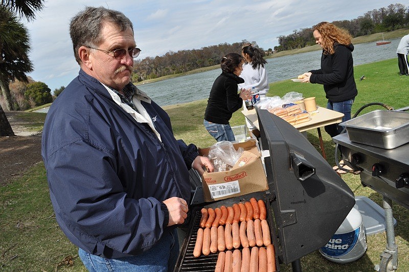 Heritage Harbour resident Ken Hartwell cooked up hot dogs for fellow residents.