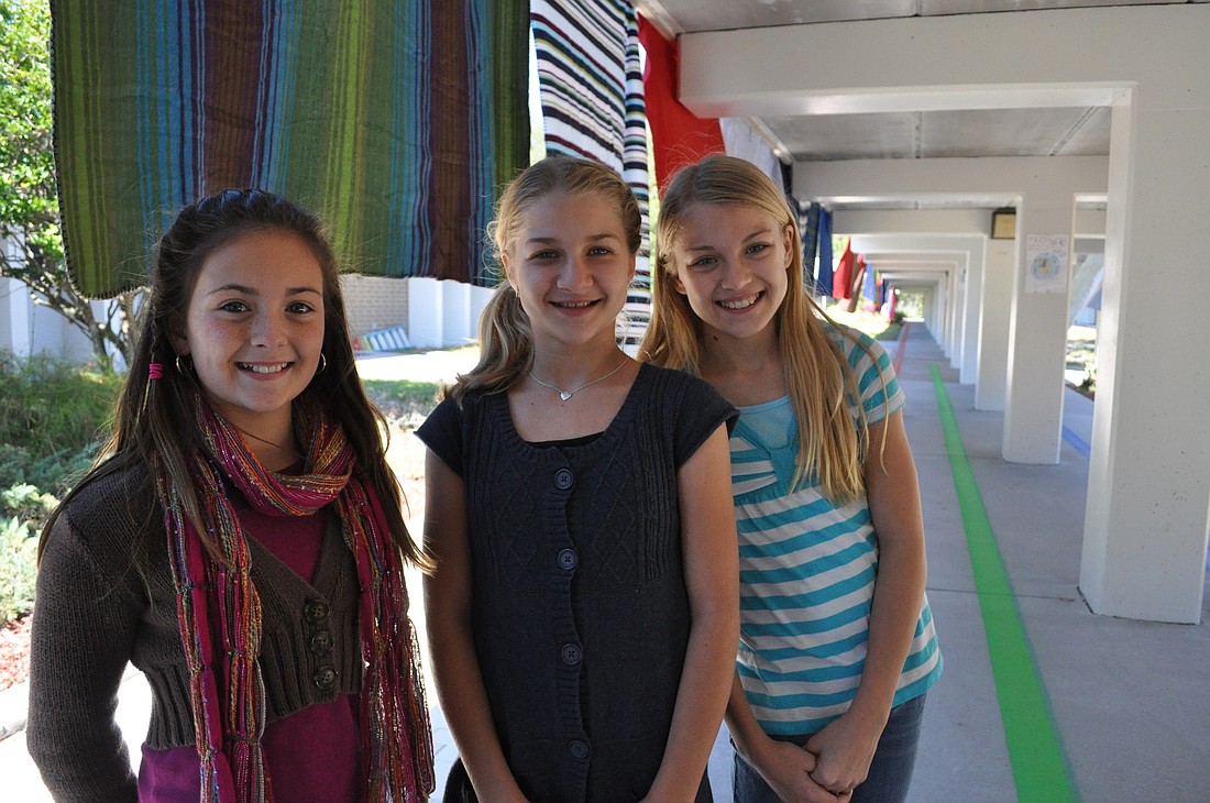 Witt fifth-graders Holly MacLeod, Zoe Schaeffer and Ivy Proffitt are eager to get started on their next art project.