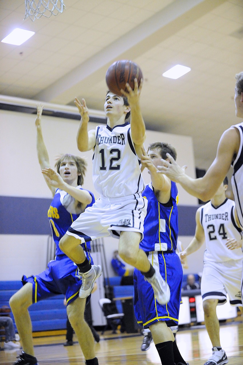 Junior guard Brian Ragone goes up for a layup in the first half. Ragone finished with 13 points on the night.