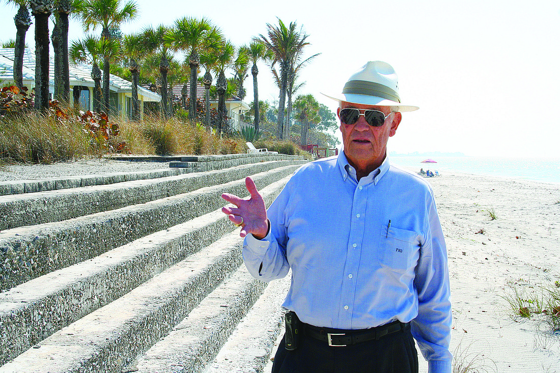 Sarasota contractor Fred Derr, stands beside a 17-step soil cement-step revetment project he built on Casey Key.