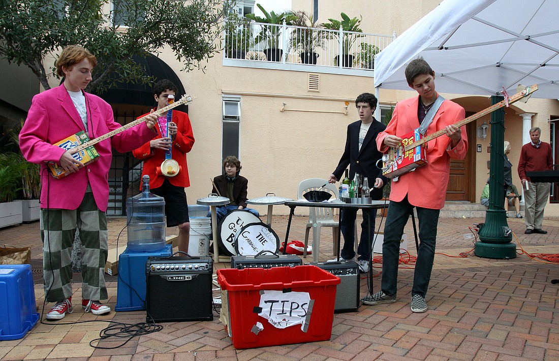 Jack Berry, Harrison Paparatto, Ollie Gray, Austin Seigel and Evan Tucker of "The Garbage Man" band perform on Jan. 22 at the Farmer's Market.