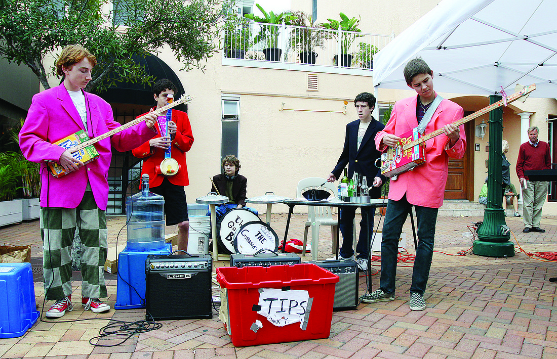 Jack Berry, Harrison Paparatto, Ollie Gray, Austin Seigel and Evan Tucker perform at the farmers market.