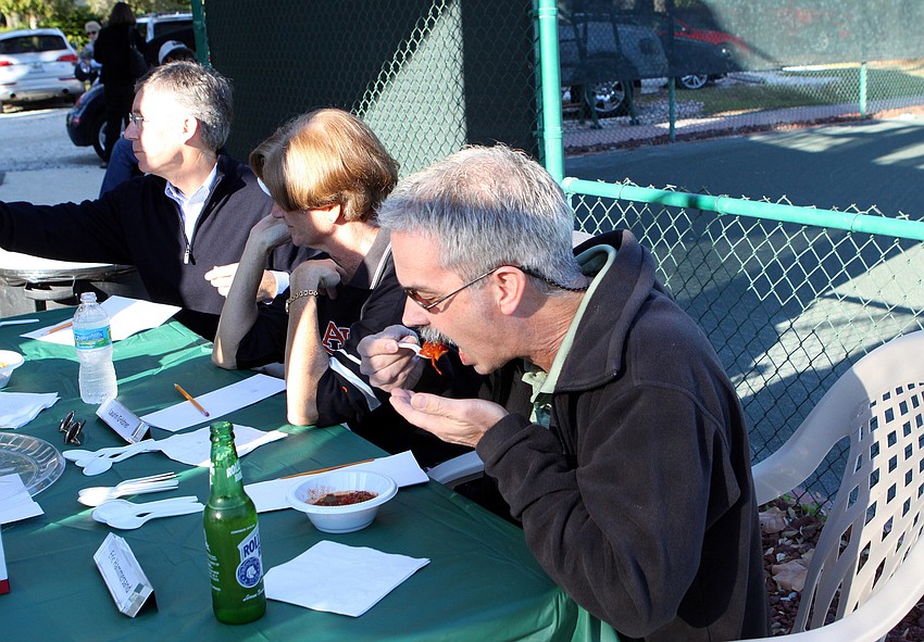 Chili Cook-off judges Matt Walsh, Laurin Goldner and Eric Hammersand try bowls of chili on Friday, Jan. 28 during Longboat Key Public Tennis Center's Chili Cook-off competition.