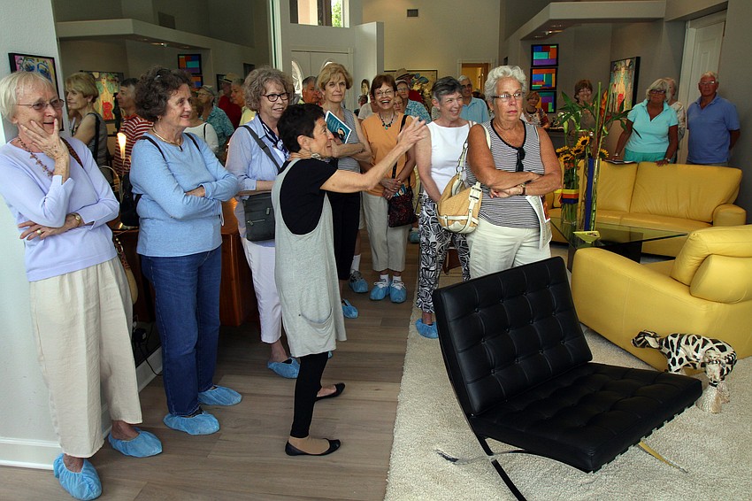 Susan Landau talks about a piece of art in her house on Saturday, March 5 at her home, one of the homes on the Home and Garden Tour.