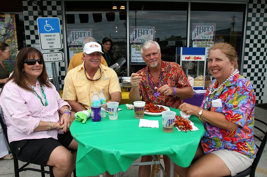 Melanni and Randy Fowler sit and enjoy crawfish with Bill and Marian Pomeroy.