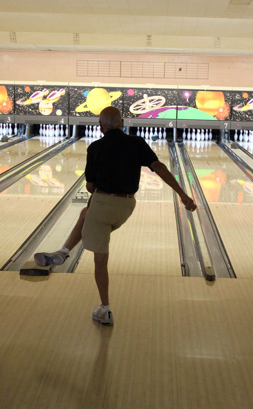 Dave Bianchi of SYC kicks to the left hoping his bowling ball will follow suit during the BKYC v. SYC bowling tournament on Monday, Feb. 28 at Sarasota Lanes.