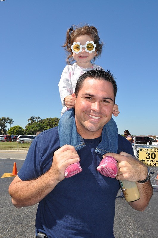 Ken Wagner gave his daughter Hailey a birds-eye view of the festivities.