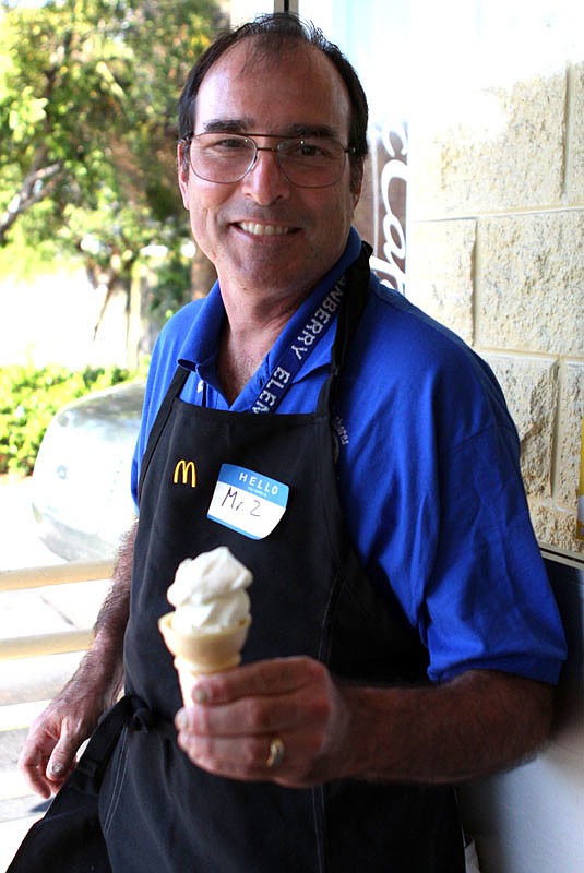 First grade teacher, Ron Zimmerman, enjoys some ice cream after his shift at McTeacher's night.