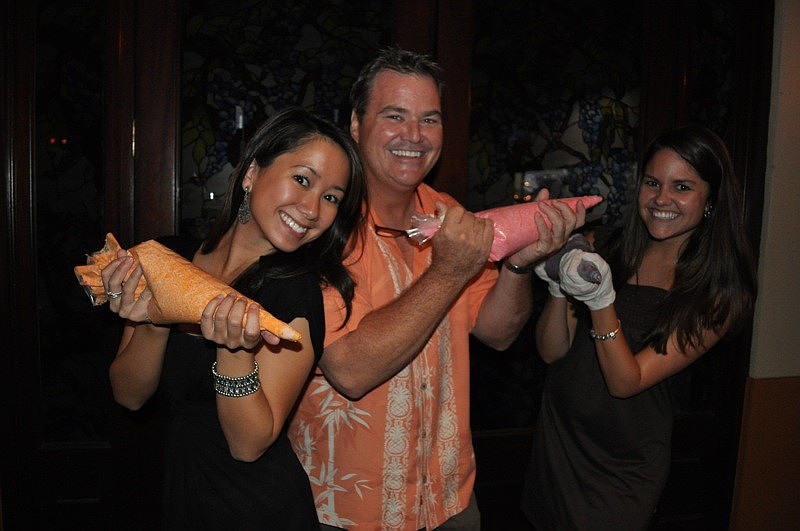 Melissa Vu, Tommy Klauber and Erin Holleran of the Polo Grill served as judges of the pumpkin carving contest.