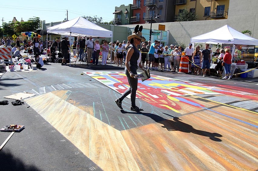 Sharyn Namnath, from Santa Barbara, CA., dressed for Halloween, gets ready to start working on a group piece.