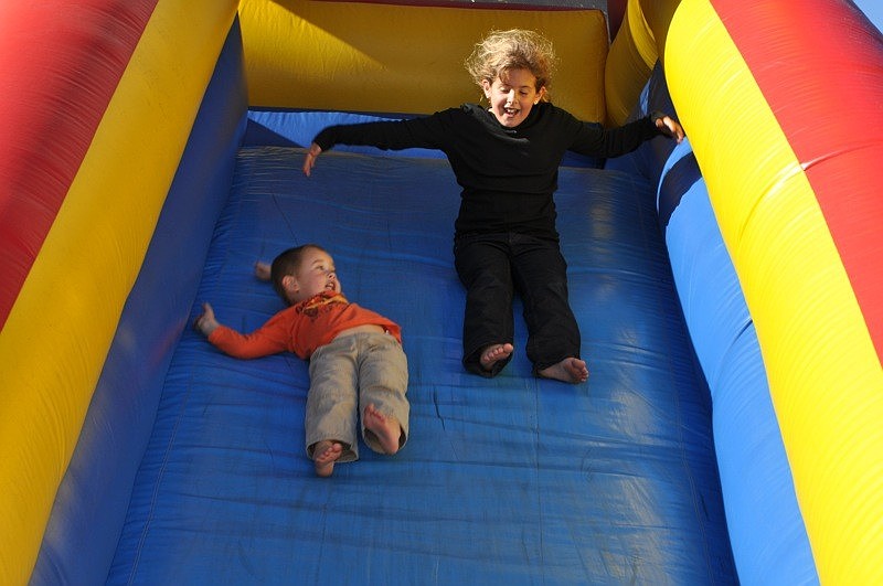 Stephen Peloquin, 3, made a new friend, Carley Rodgers, on the slide.